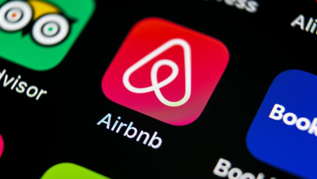 When does Airbnb charge you?