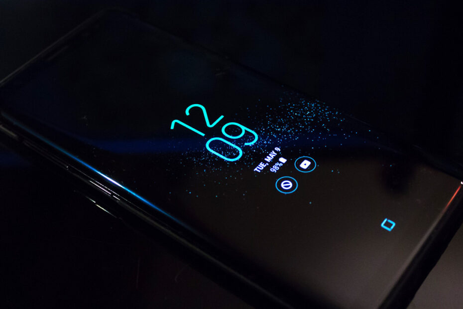 A smartphone displaying the date and time.