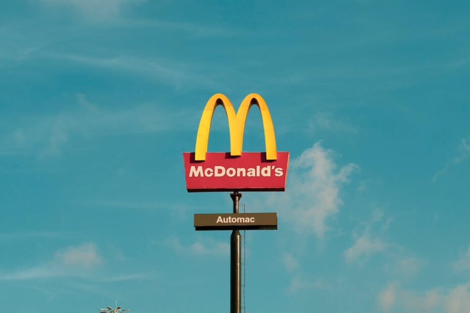 A mcdonald's sign on a pole.